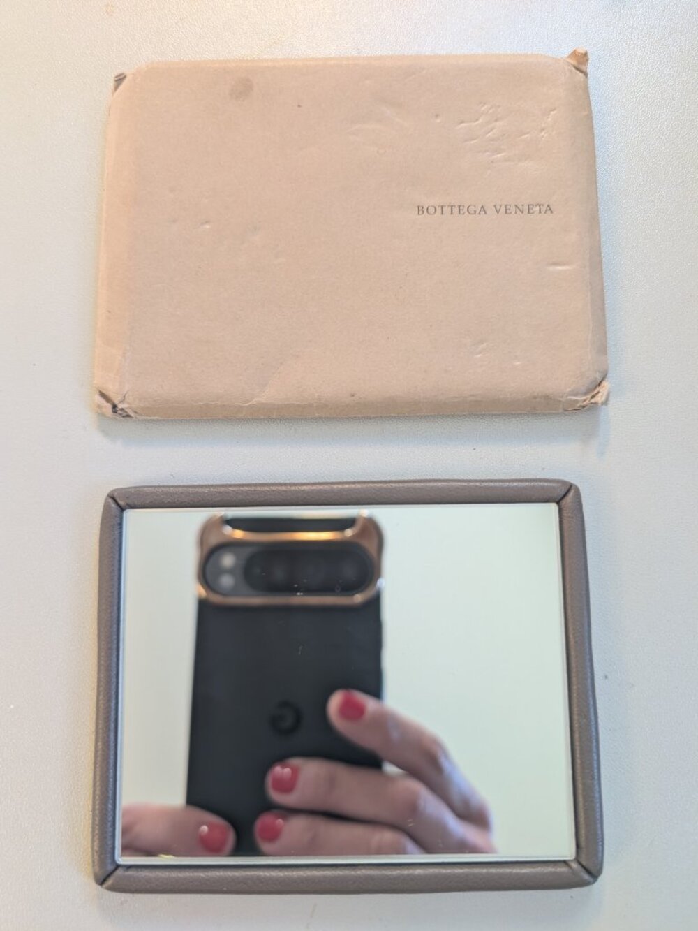 Bottega Veneta leather purse mirror in taupe-sable color